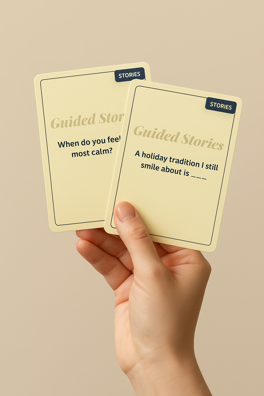 A hand holding two Guided Stories conversation cards